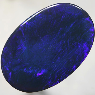 SOLID BLACK OPAL Very Large blue on black, Broad electric rolling flash. SEE VIDEO